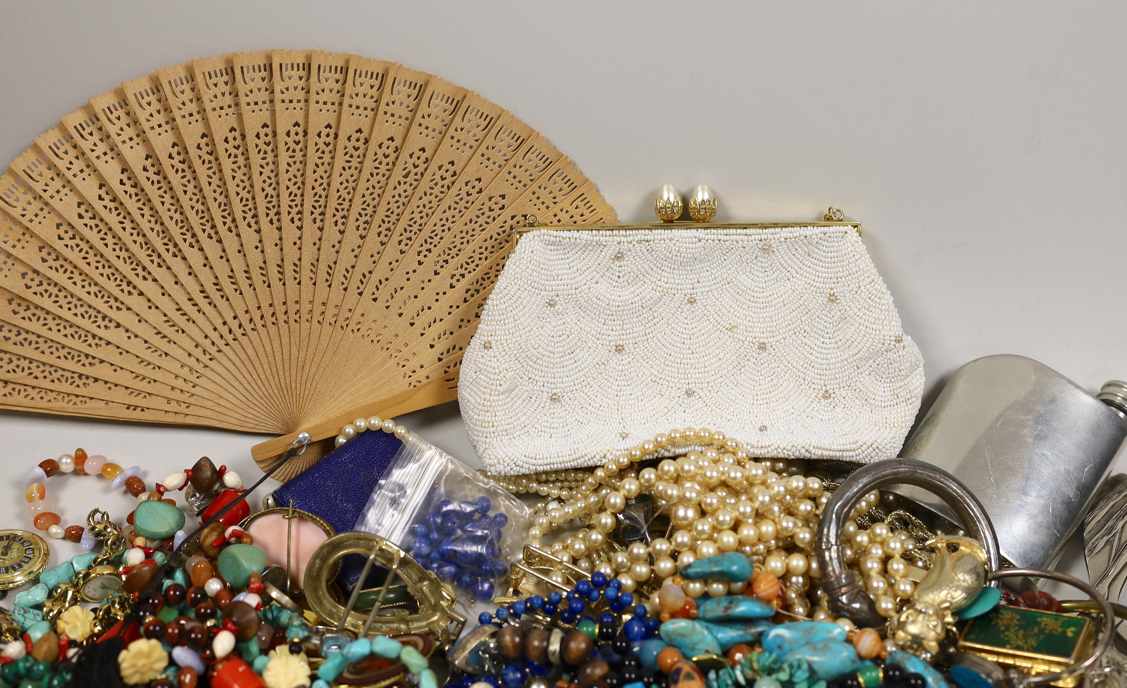 A quantity of assorted costume jewellery, including white metal and moonstone bracelet and other items including a small silver plated Dunhill lighter.